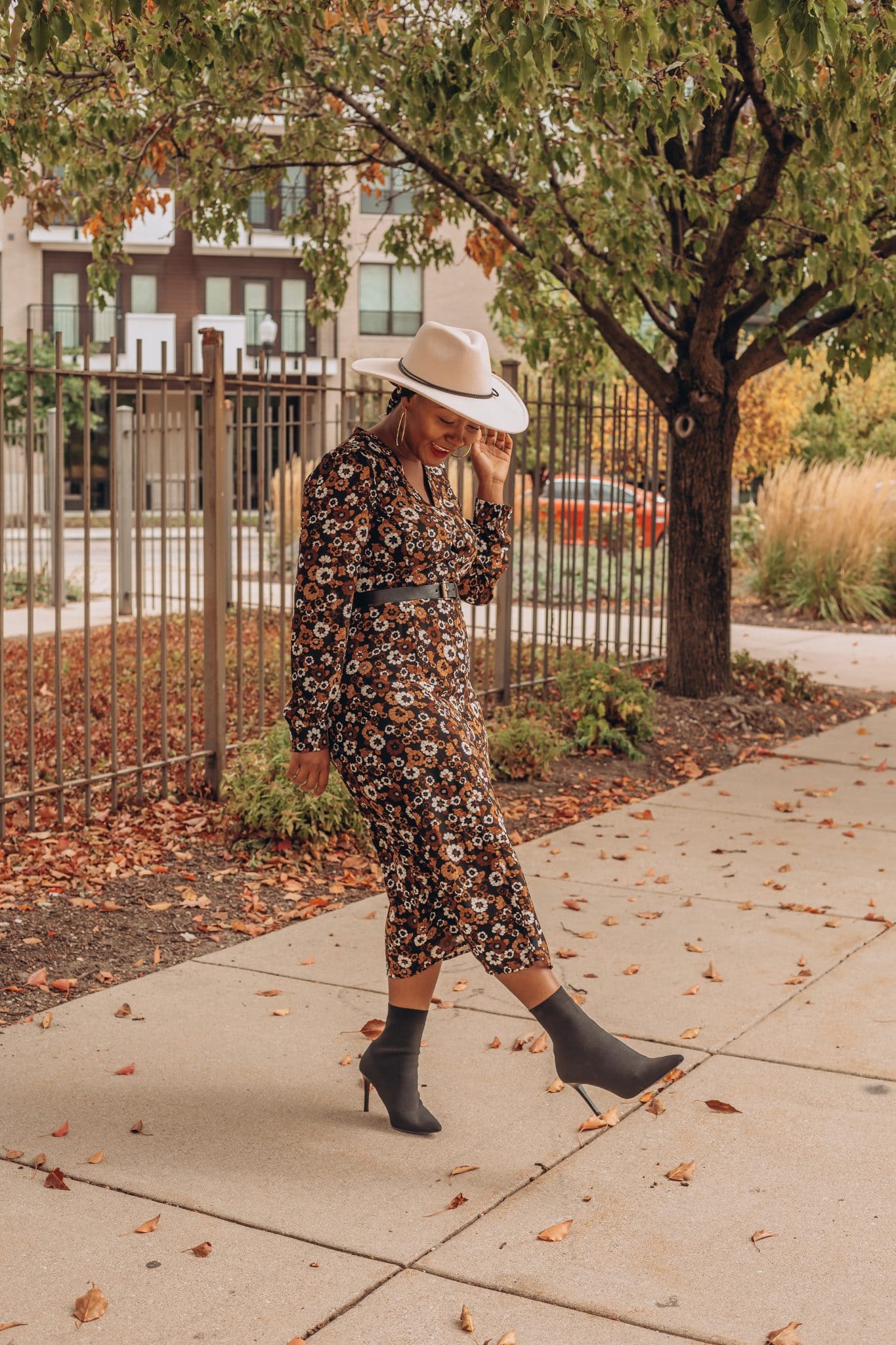 Fall dress outfit featured by top Indianapolis life and style blogger, Tales and Turbans: image of a woman wearing a Stitch Fix floral maxi dress and Zara boots.